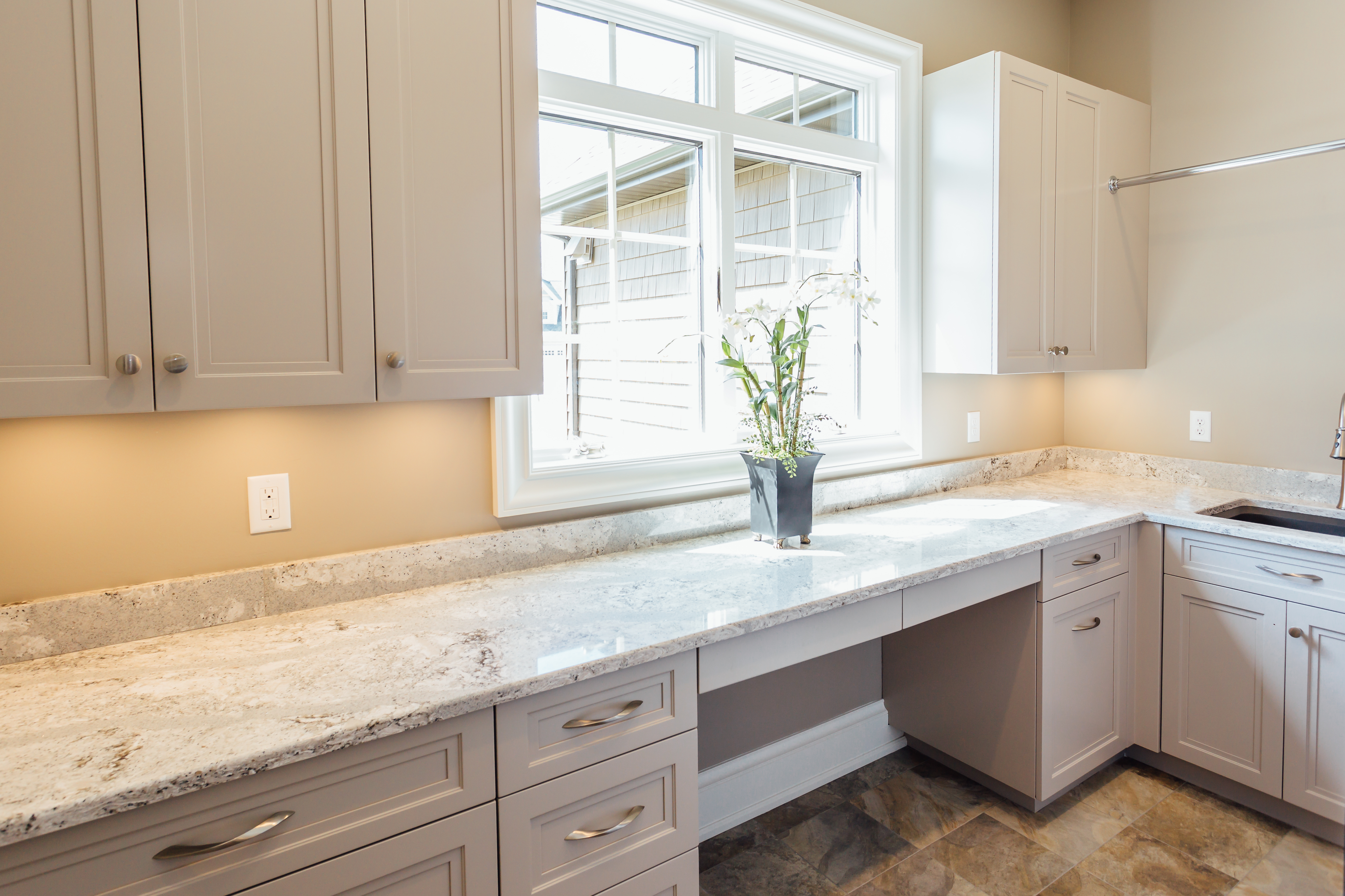 custom Taupe laundry room cabinetry - Custom Cabinetry & Millwork, specializing in kitchen cabinetry, bath vanities, dens, home office, commercial trim millwork and more. Elite Designs International serves the Buffalo & Western New York area including, Fredonia, Williamsville, Lockport, Hamburg, Orchard Park, Lancaster, Tonawanda, & more! 