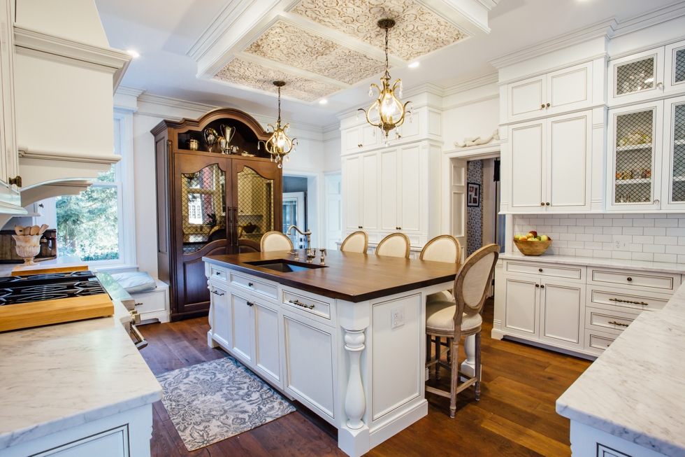 White Glazed Kitchen with Walnut Countertop - Elite Designs International - Custom Cabinetry & Millwork Buffalo & Western New York #carraramarble #subwaytile #appliancepanels #wood