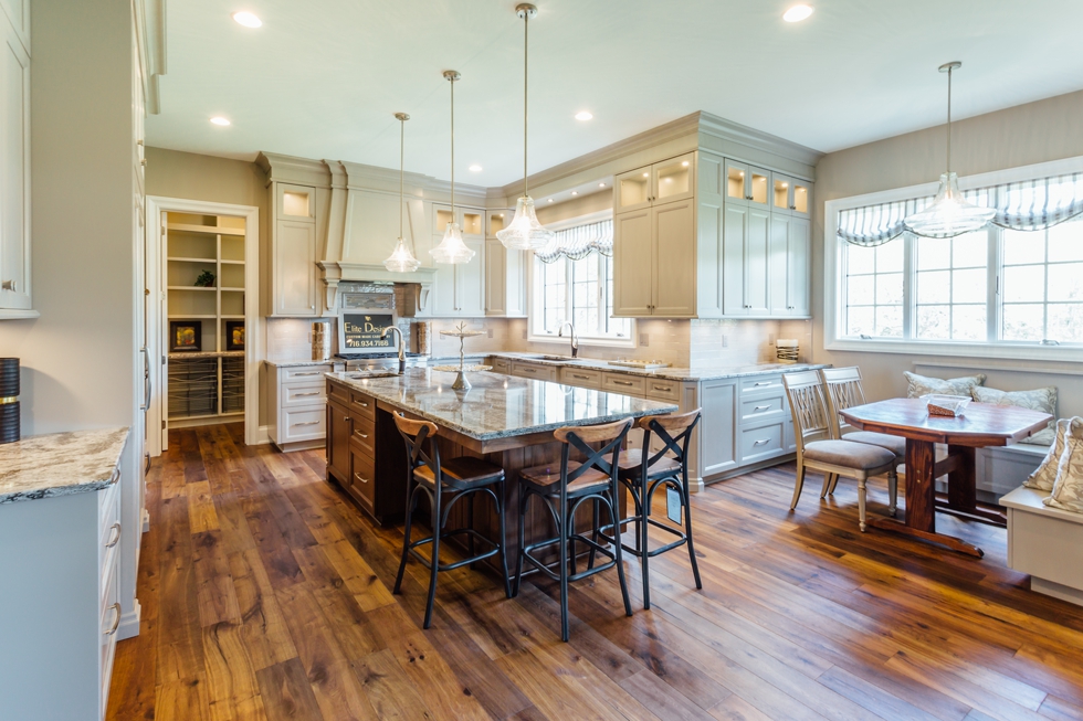 Taupe Custom Kitchen with Wood Island & Pantry - Family owned western new york custom cabinetry serving williamsville, amherst, clarence, and east aurora. #benjaminmoore #plymouthrock #recessedcabinetry #undercabinetlighting #jenn-air #woodisland #cambriacountertops #breakfastbanquet #homeshow