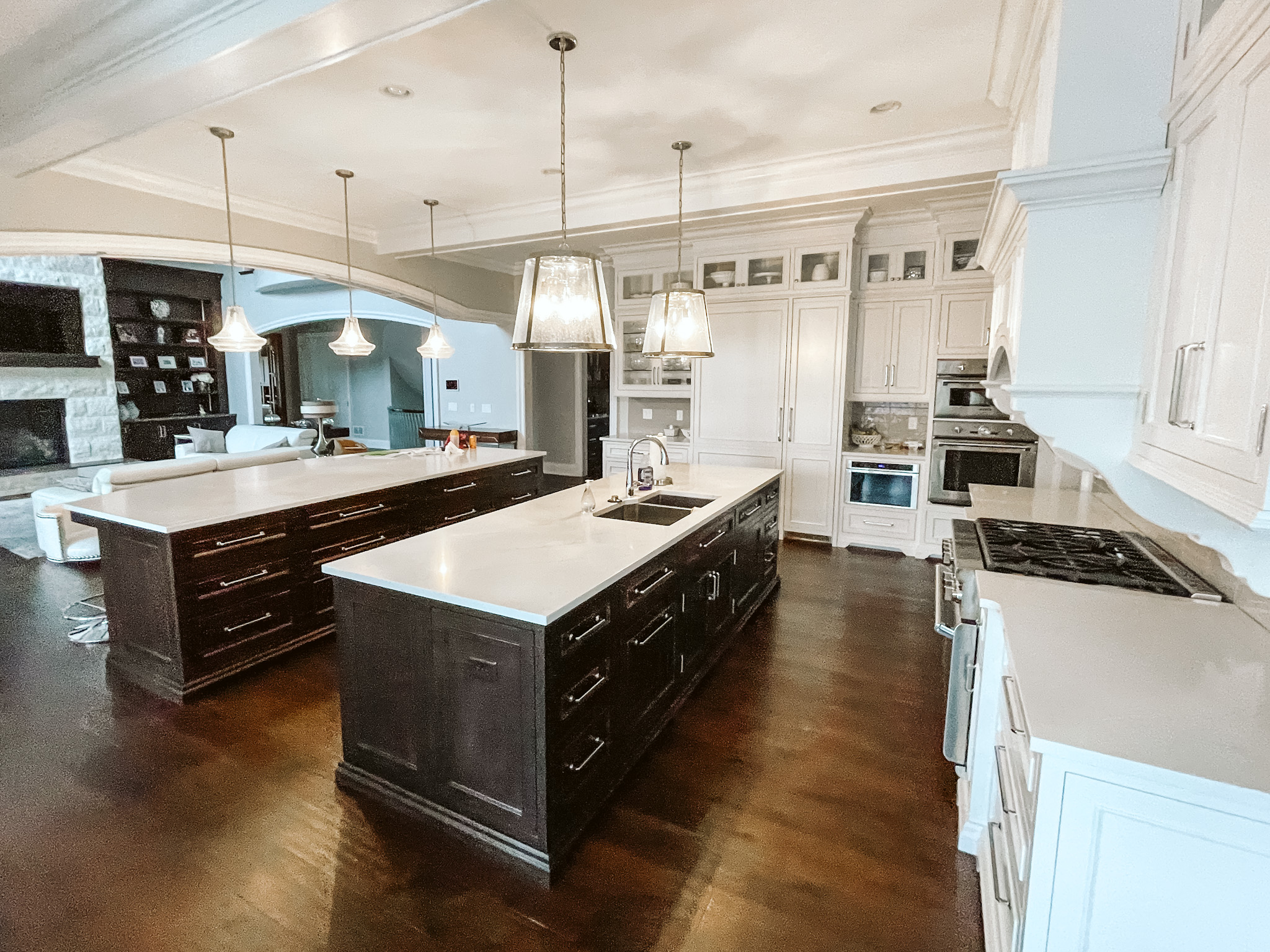 Double wood island kitchen with painted white cabinetry