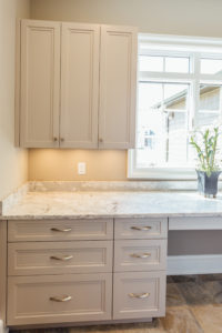 custom Taupe laundry room cabinetry