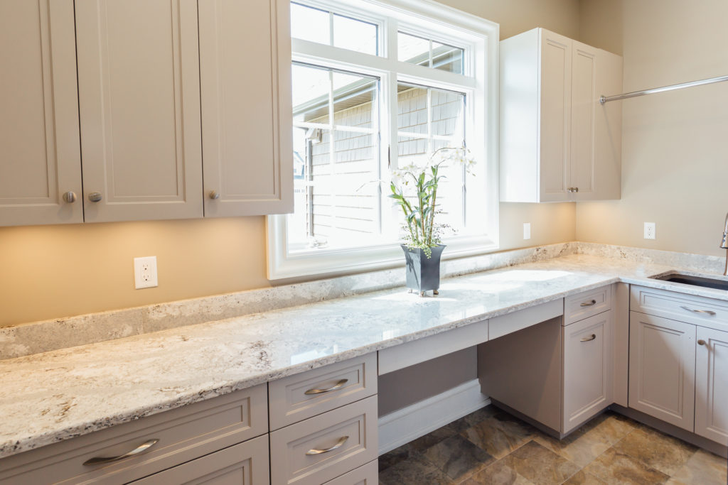 custom Taupe laundry room cabinetry