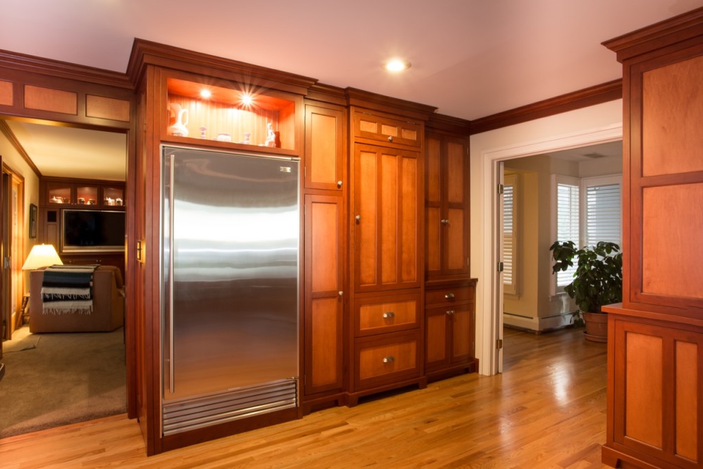 Custom Painted Kitchen - with french blue china hutch, granite countertops, light soffit, crystal chandeliers , wood bar, storage, refrigerator door