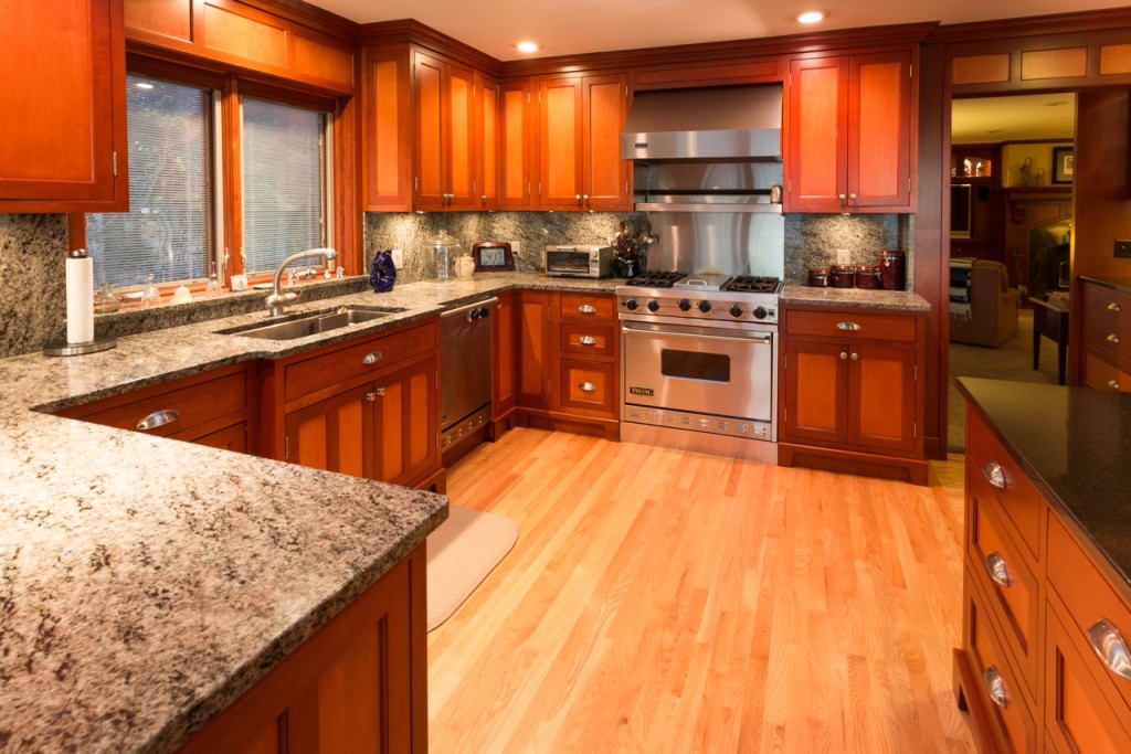 Custom Painted Kitchen - with french blue china hutch, granite countertops, light soffit, crystal chandeliers , wood bar, storage, refrigerator door