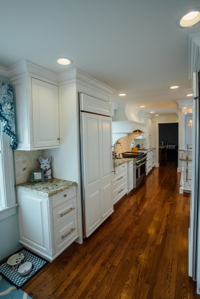 Custom Painted Kitchen - with french blue china hutch, granite countertops, light soffit, crystal chandeliers , wood bar, storage, refrigerator door