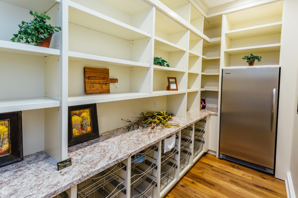 Taupe custom kitchen with wood island and large pantry - Buffalo & wny family owned cabinetry & millwork #pantry #kitcheninspiration #storage