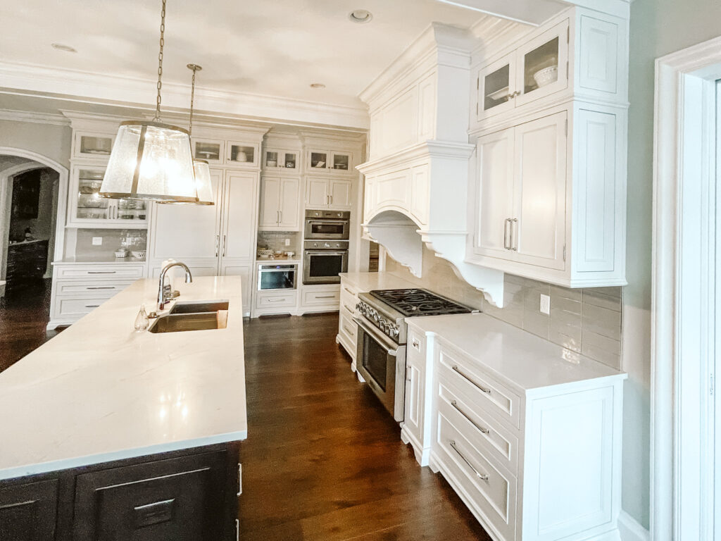 Double wood island kitchen with painted white cabinetry